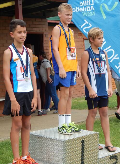 Reaching new heights: Local boy Maxwell Cracknell receiving the silver medal at the Regional Championships in Lismore last month.