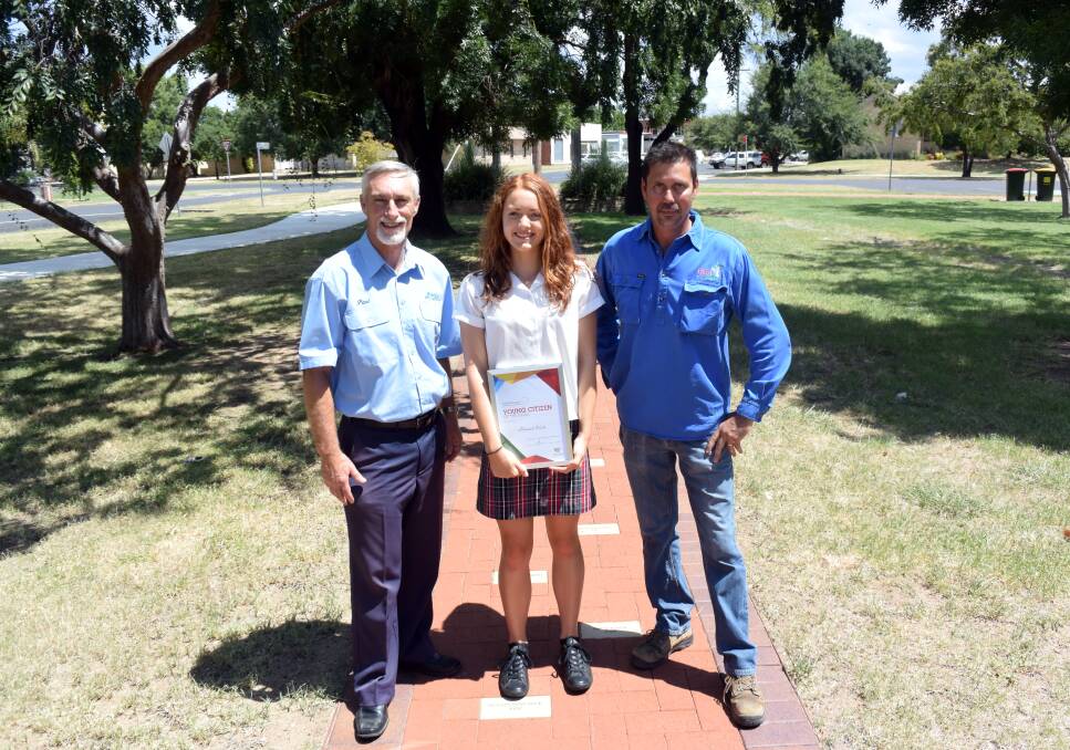 Big honour: Mayor Paul Harmon, Young Citizen of the Year Hannah Wales and Citizen of the Year Danny Middleton take a stroll down the 'walk of fame' in Victoria Park earlier this week.