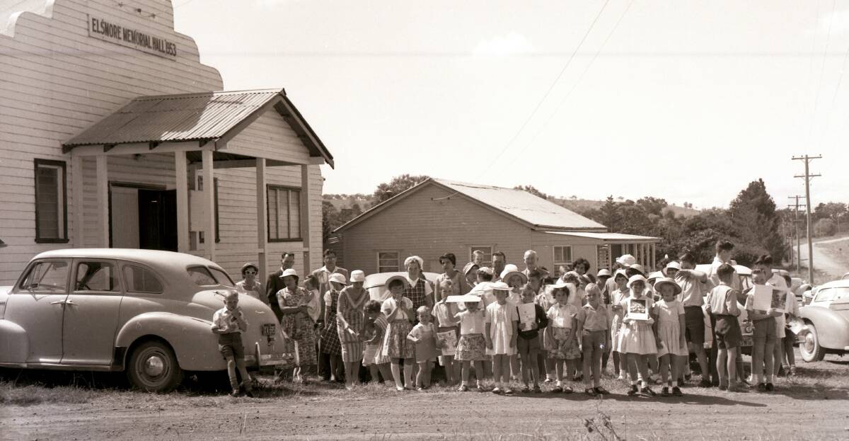 Part of the community: Children and adults all dressed up for an event at Elsmore Soldiers' Memorial Hall, possibly during the 1950s.
