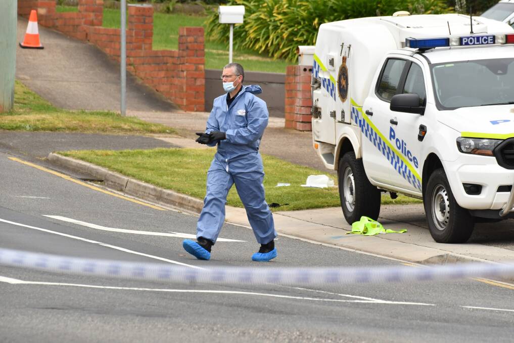 A forensic investigator on the scene of the Devonport murder-suicide. Picture: Brodie Weeding