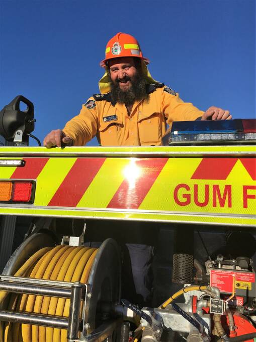 White hot: Captain Ray White aboard the Gum Flat community's bush fire truck. Photo: Heidi Gibson