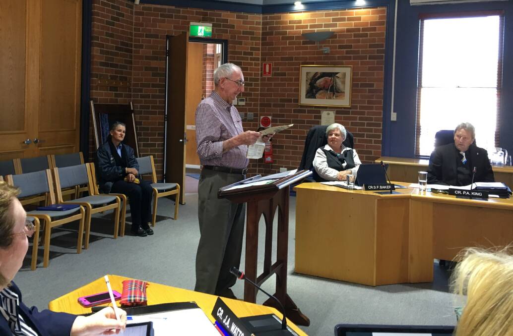 Hospital planning concerns: Bob Bensley addresses Inverell Shire Council starting with a newspaper article from 1977. Photo: Heidi Gibson