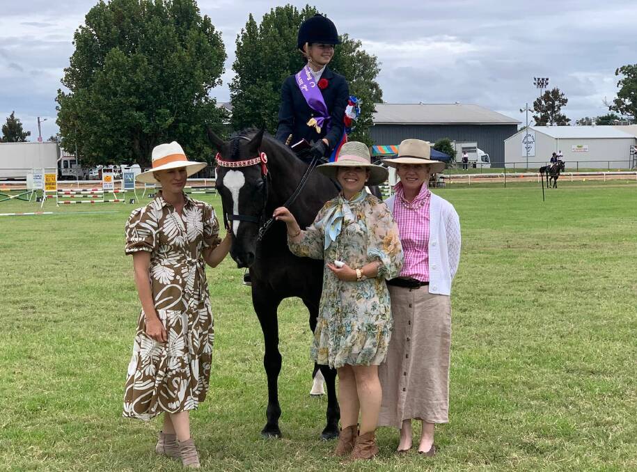Ally Palmer accepts her sash for Supreme Rider during the Inverell Show. picture: Show society. 