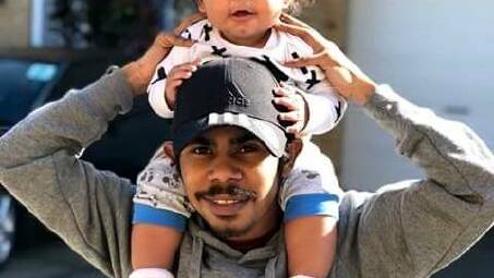 Gordon Copeland pictured with his first-born son. Picture supplied by NSW and ACT Aboriginal Legal Service