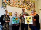 SPREADING HOPE: Emma Stilts, Joanne Stead, Jonathan Stilts and Jodie Herden holding some of the patches for the giant quilt. Photo: Gareth Gardner