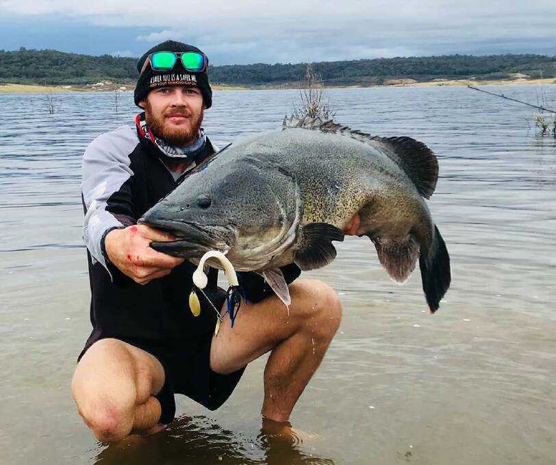 Ty Edmonds shows off his catch.