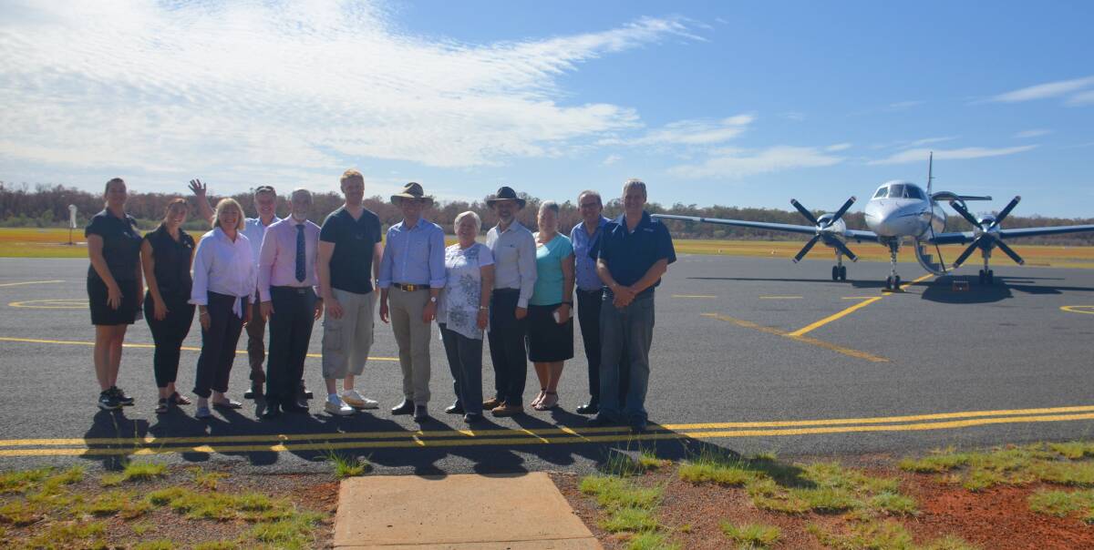 Inverell's first Sydney passenger in 10 years, Jeremie Kerridge (centre) with Inverell Shire councillors, members of the Air Service Working Group, member for the Northern Tablelands Adam Marshall and other supporters. 