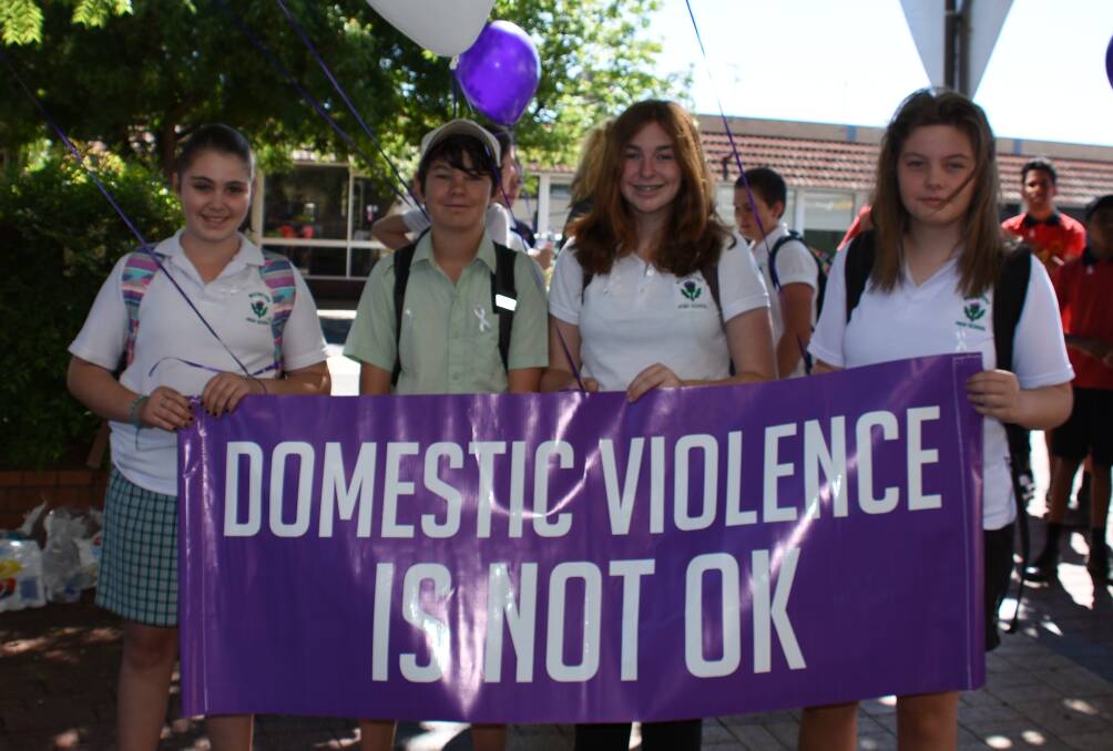 Local students stand against domestic violence in 2017.