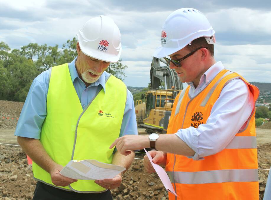 Inverell Shire mayor Paul Harmon and Northern Tablelands MP Adam Marshall look over the progress of the hospital construction. 