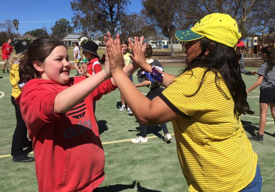We're OK: Charlette and Paige give each other a high ten during the fitness session. There will be a free parents and community session at Ross Hill next Wednesday night.