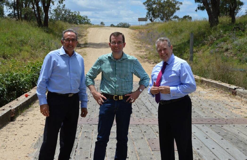Deputy mayor Anthony Michael and Member for Northern Tablelands Adam Marshall with Inverell Shire Council general manager Paul Henry on the bridge before the upgrade.