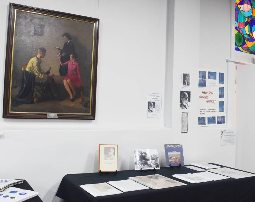 The painting 'Studio Trio' is once again on display at the Inverell Art Gallery, alongside a collection of resources outlining Douglas Dundas' career and the history of the painting.