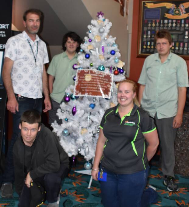 Tim Chard, Nathan Kirk, Cody Sydenham, (front) Lloyd Riley and Ashleigh Taylor decorated the striking tree in the foyer of the club in the hopes of attracting the attention of customers as they walk through the door.