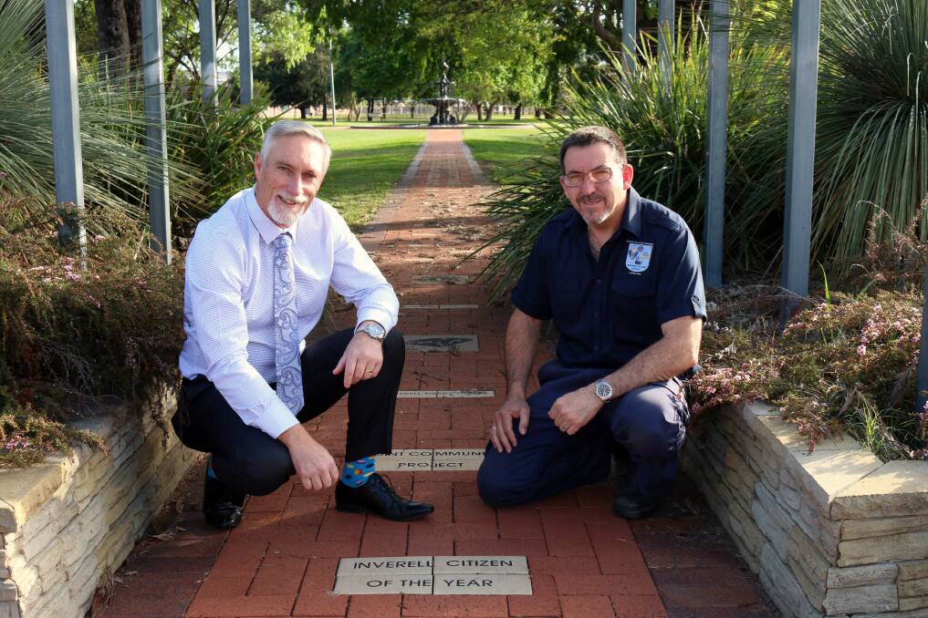 Inverell Shire Council mayor Paul Harmon with Inverell-Macintyre Lions Club’s Duane O’Brien at the commemorative path honouring previous Australia Day award recipients.