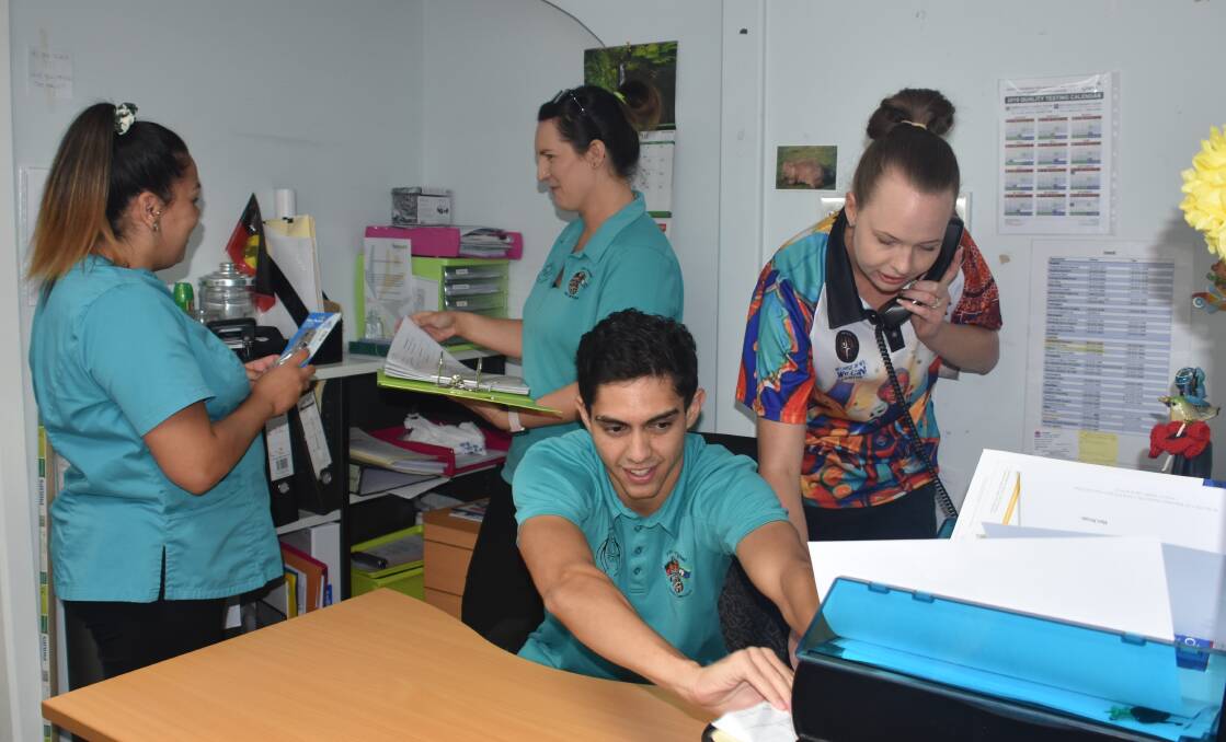 Cosy: Megan McIntosh and Tara Price with (front) Brock Kinchela and Lucy Ridds in one of Armajun Aboriginal Health Service's current offices. 