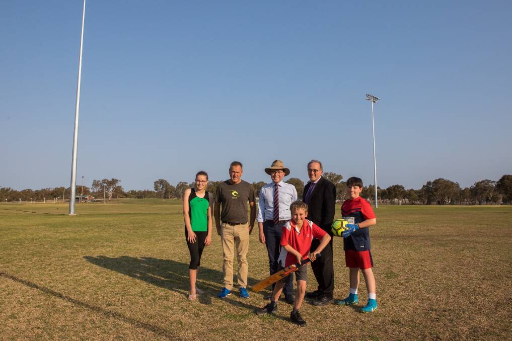 Inverell athlete Jessica Kastelein, Inverell Sports Council’s Kerry Stafford, Northern Tablelands MP Adam Marshall, Inverell Shire Deputy Mayor Anthony Michael and local junior soccer player Bayley Brien Parr with junior cricketer Henry Oliver (front) at celebrating extra funding for the Inverell Sports Complex.