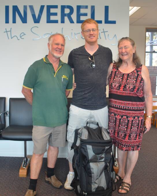 Jeremie Kerridge (centre) was seen off by his parents Graham and Heather Kerridge, on Inverell's first commercial Sydney flight in 10 years.