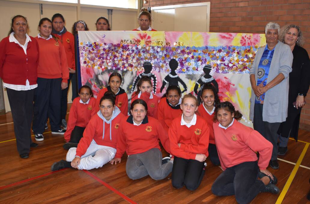The school's Indigenous girls, from years 7-11, came together to paint the banner.