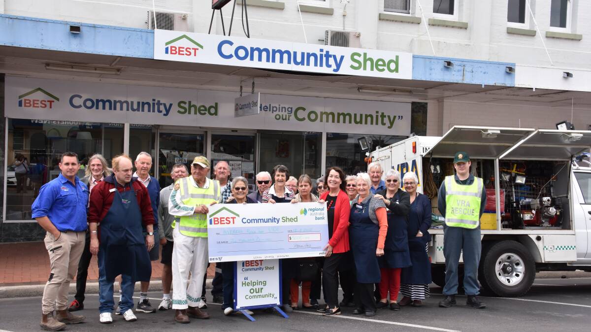 BEST Community Shed volunteers hand over $5000 to the Inverell Rescue Squad to help upgrade their truck. 