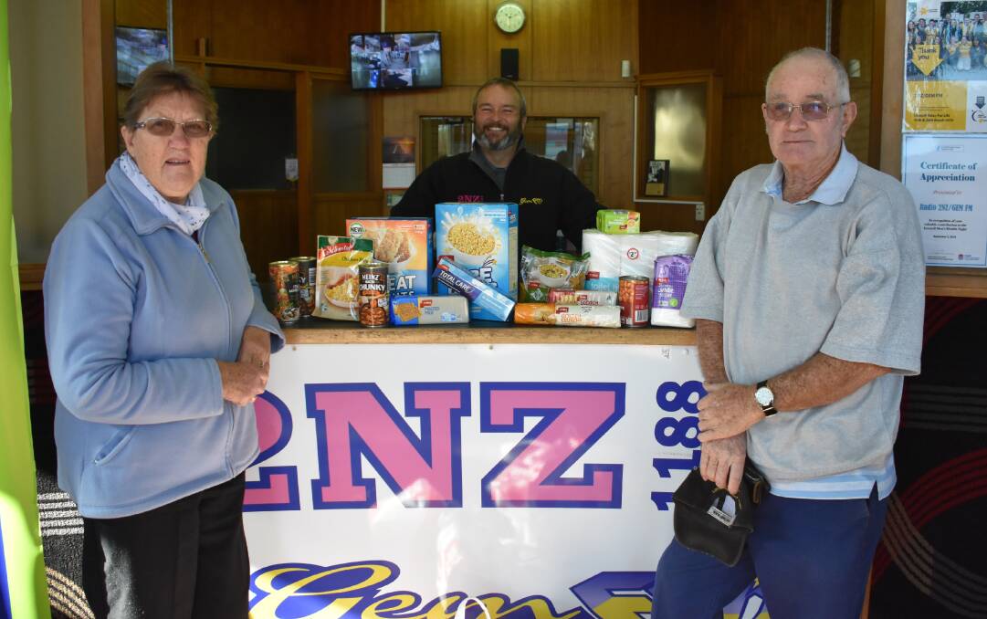 James ‘Monte’ Irvine (centre) was thrilled when Glen Innes couple Mary and Terry Pickham donated several bags of food just hours after the drive was announced.