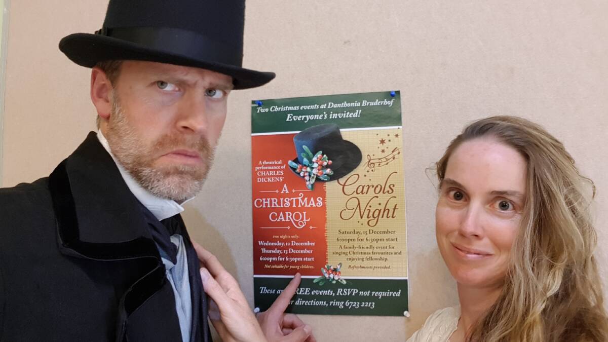 Ebenezer Scrooge and the Ghost of Christmas Past (Chris and Norann Voll) invite locals to come along to the free performance.
