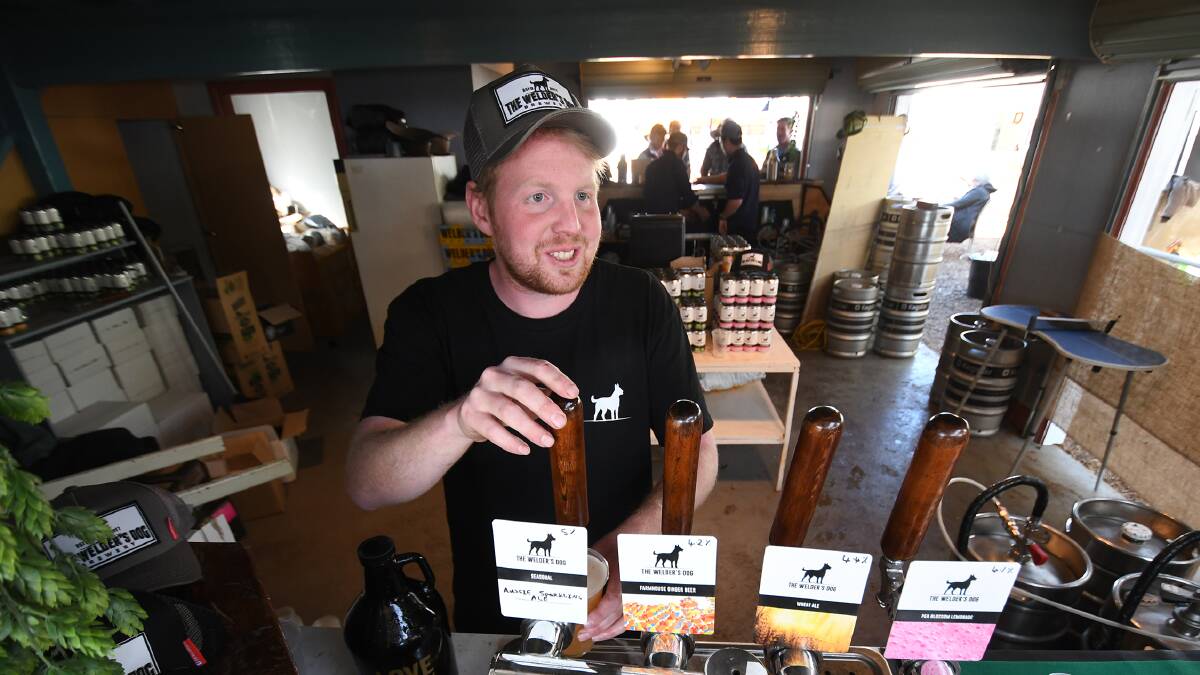 DELIGHTFUL DROP: The Welder's Dog brewer Daniel 'Beans' Coffey is working on a honey and lilac beer to bring to Forage Festival in Armidale. It's the first music, beer and food festival of its kind to be held in a carpark in the region. Photo: Gareth Gardner