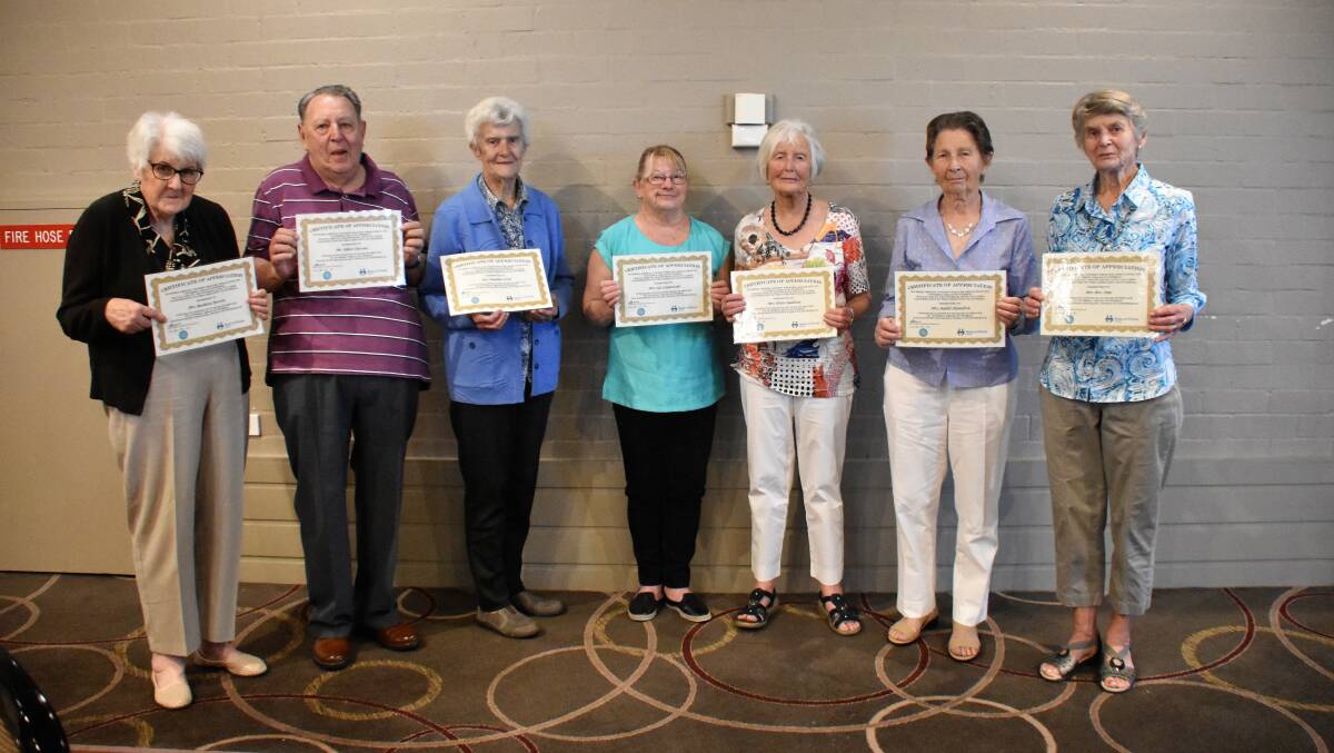 Bert and Barbara Parsons, Pauline Croft, Sue Szumowski, Helen Baldwin, Judith Hamilton and Bev Sims with their certificates of appreciation from Meals on Wheels.