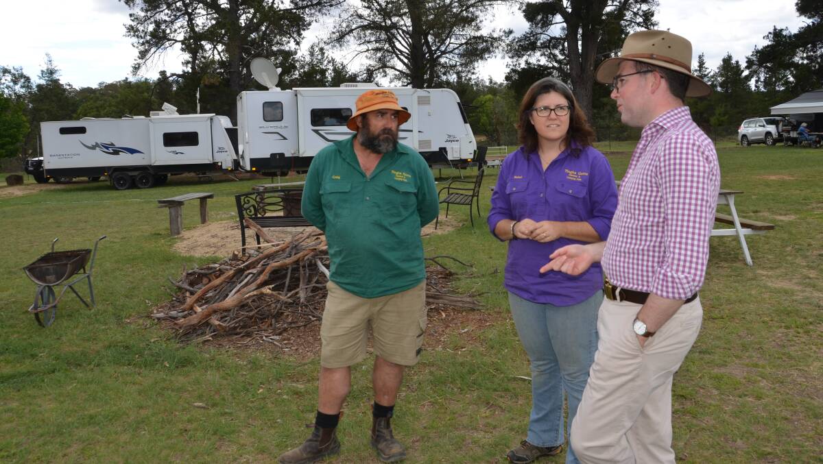 Tingha Gens Caravan Park managers and caretakers Craig and Rebel Bright, left, with Northern Tablelands MP Adam Marshall at the site where the new communal under cover barbecue area will be constructed at the park.