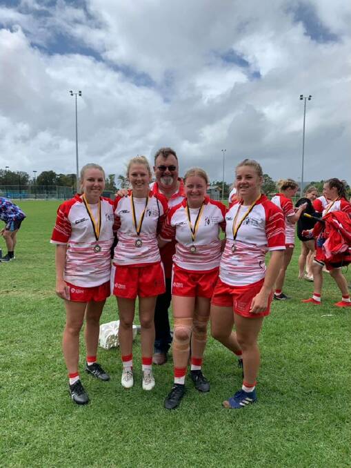 State selection: Inverell's Nicola Robinson, Kearni Churchland, Bella Reardon and Lucy Prudden with coach Dale Beattie (middle) at the State Women's Country Rugby Championships in Woy Woy last weekend. Photo: Supplied.