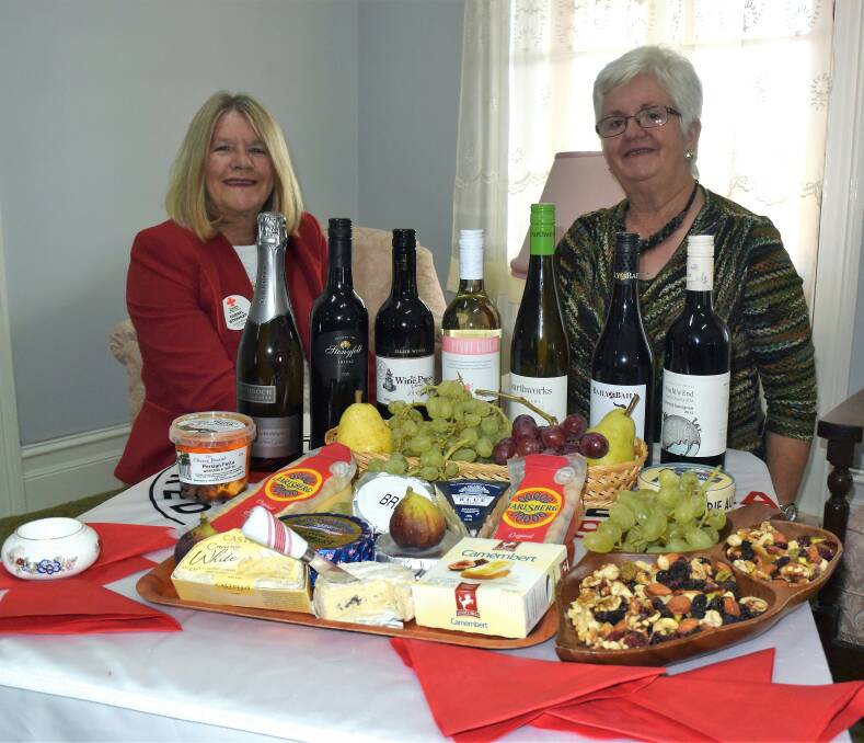 Time to unwind: Cheryl Strahley and Colleen Nancarrow of the Inverell Red Cross look forward to the wine and cheese evening tonight.