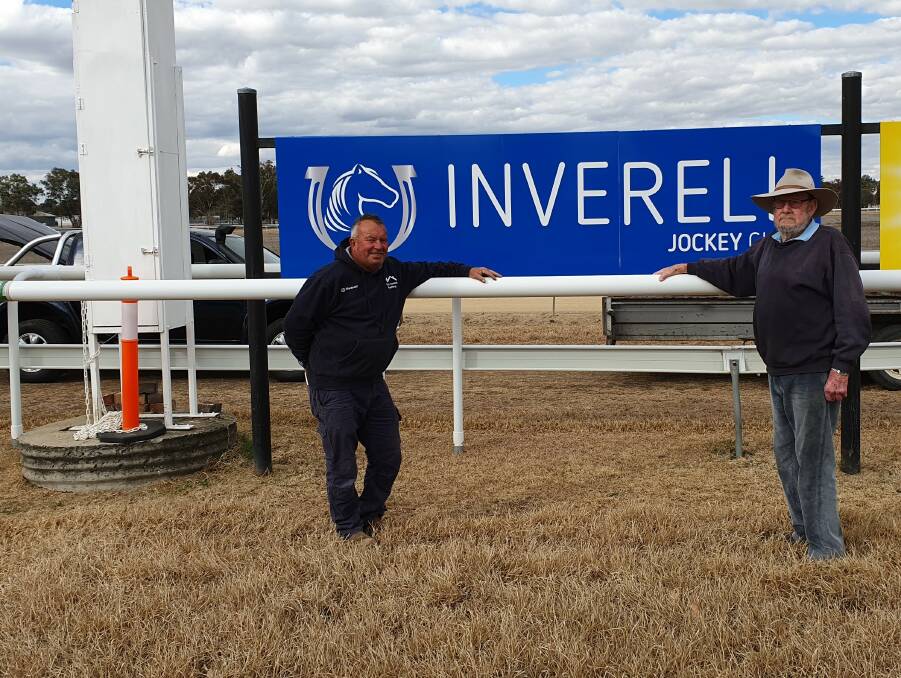 Inverell Jockey Club president and former president Mike Lyne inspect the new safety running rail installed for horse and jockey safety. 