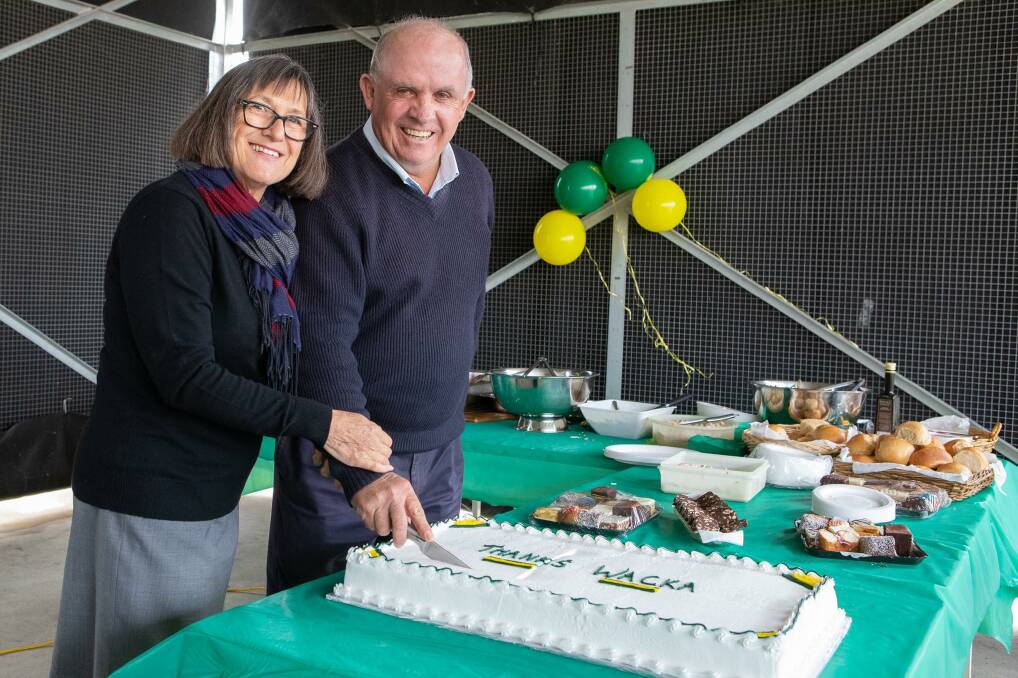 Bittersweet: Senator John Williams and his wife Nancy cut a 'thanks Wacka' cake at his farewell earlier this month.