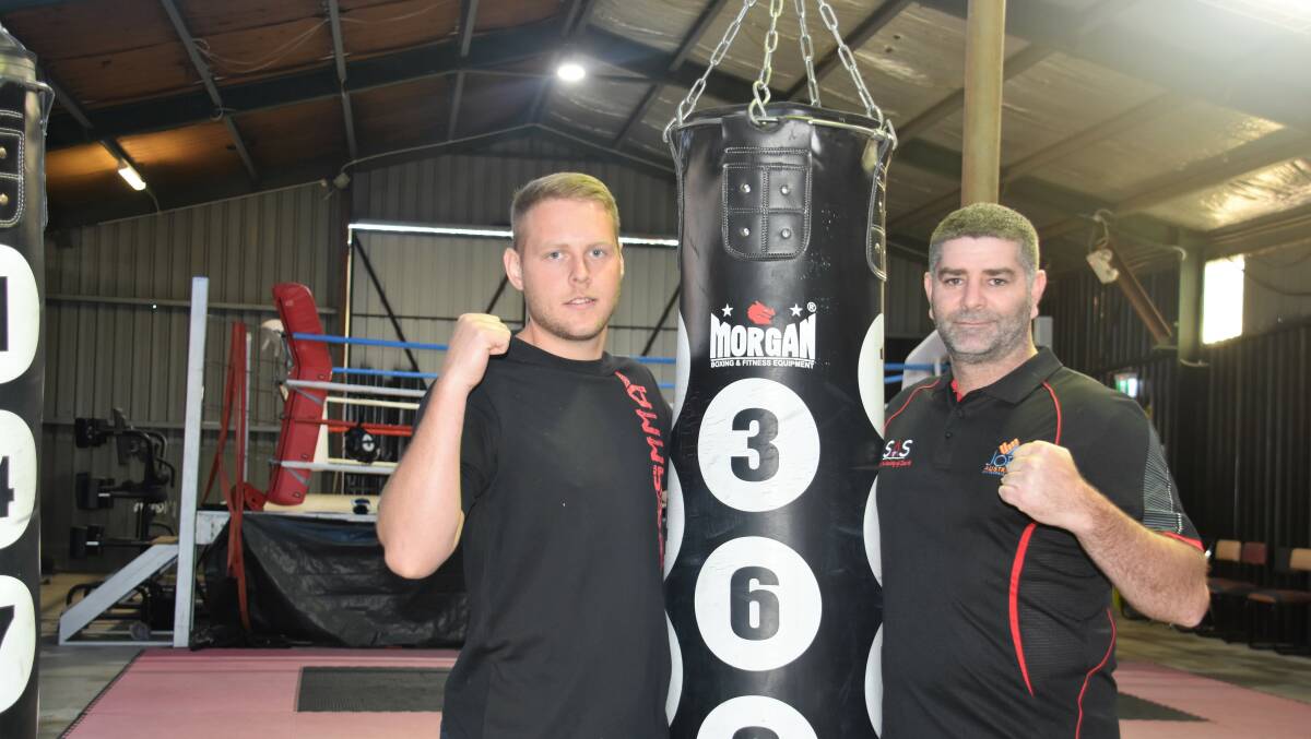 Training pays off: Sapphire Academy of Sport's Wade Macdonald and Darren Finn back in the gym following the weekend's fight night at Tweed Heads.