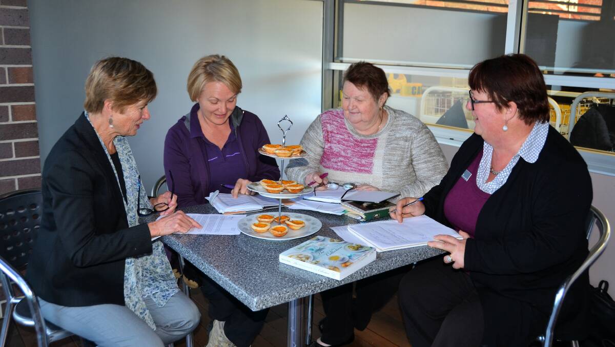 Pam McLeay, Kristy McLoughlin, Margaret Coyne and Jane Hunter busy planning for September's workshops and high tea.