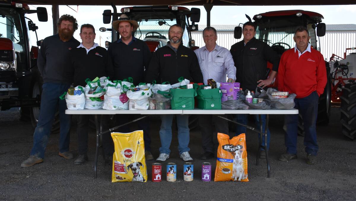 Big shop: Rusty Ian Holton, Dale Waters, Paul Carter,  James ‘Monte’ Irvine, Neil Westgarth, Nick De Stefani and Bert Trevithick with the groceries.
