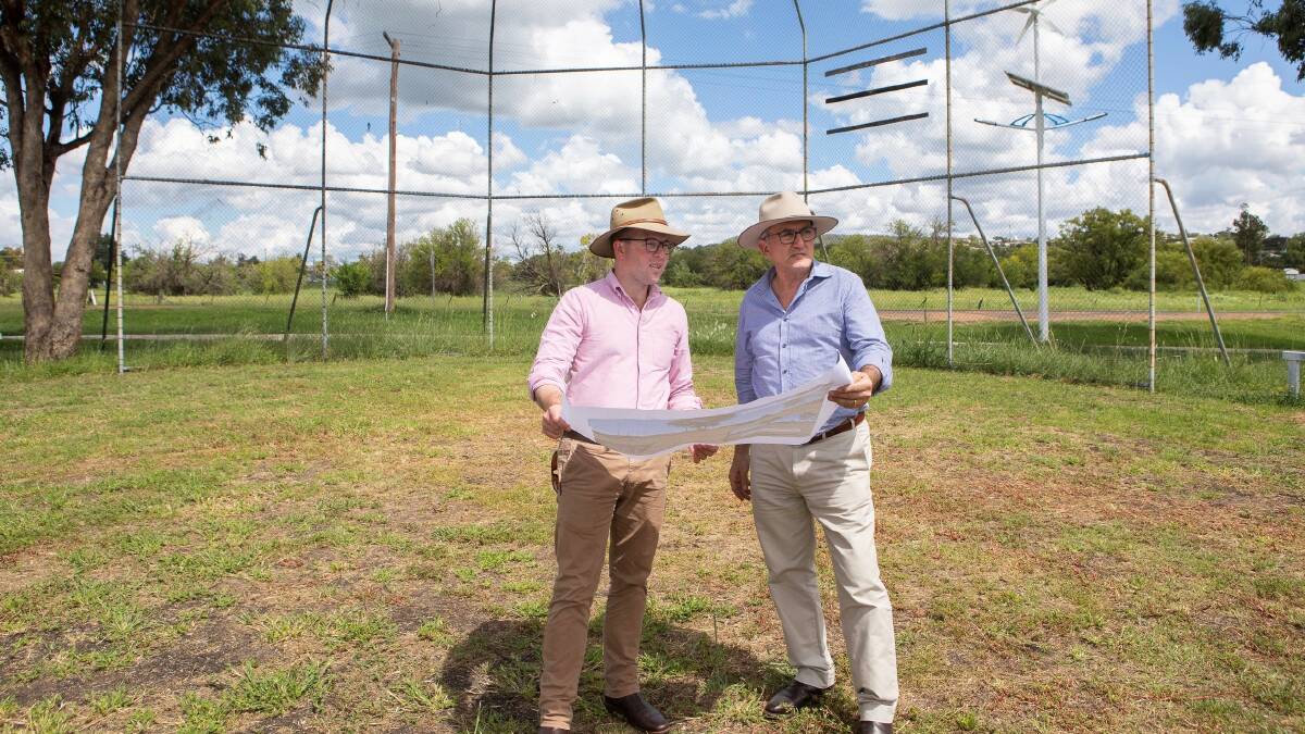 Northern Tablelands MP Adam Marshall, left, and Inverell Shire Deputy Mayor Anthony Michael inspect plans on the site of Inverells new outdoor youth space. NOTE: These photos were taken several weeks ago, before the current social gathering restrictions.