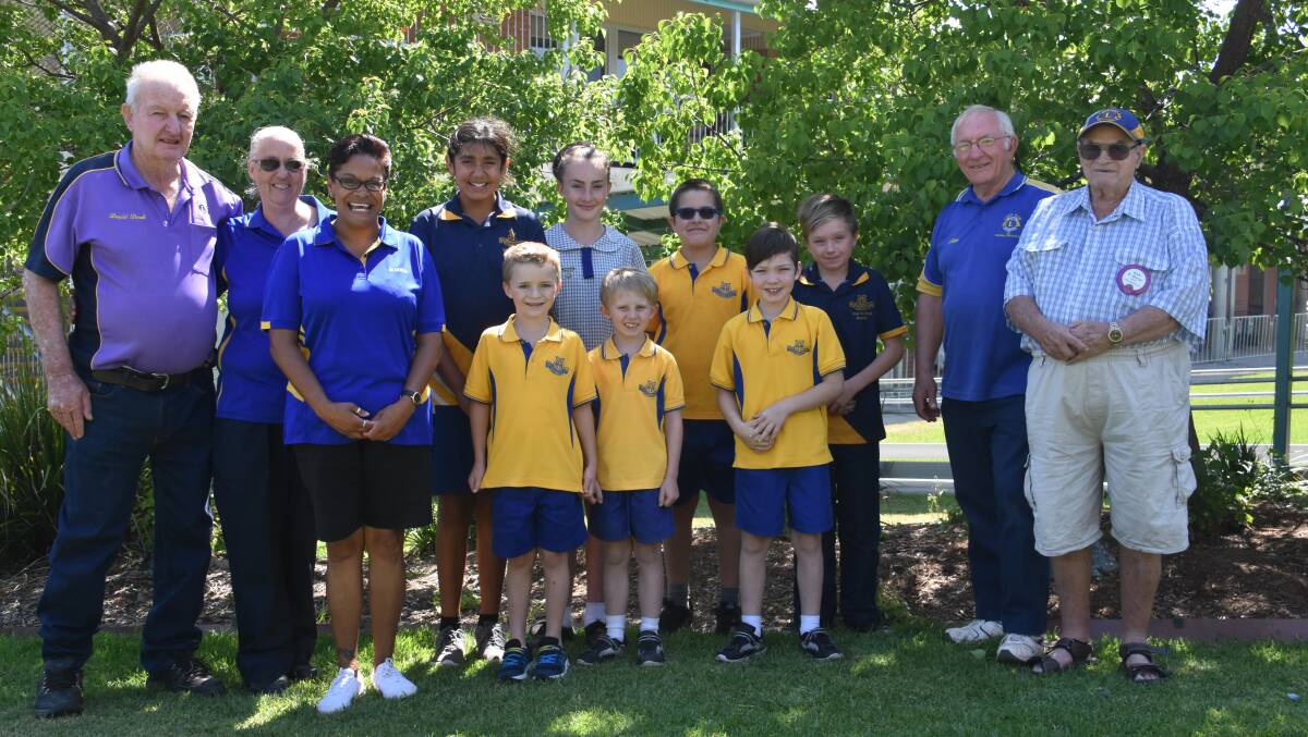 Fun times ahead: Macintyre Lions Club members David Doak, Allan Chambers and Ken Sherar with Ross Hill staff and students who will attend the school excursion.