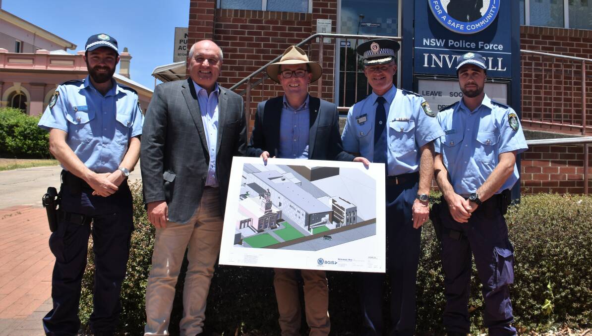 Modern building: Inverell officers gather with Minister Elliot and Mr Marshall to view the new design plans. 