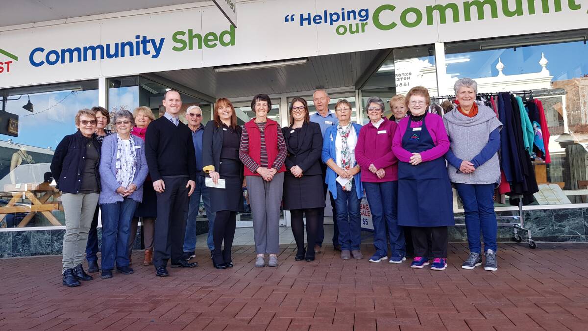 Commonwealth Bank area manager Michael Eekelschot (centre), Inverell branch manager Christie Hall, Community Shed store coordinator Robyn Kenny and Bank branch staff member Ellen Jeffrey with a team of Shed volunteers on Tuesday morning.
