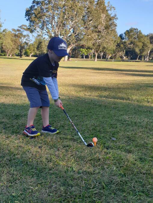 Hole in one: Young James Davis, who was diagnosed with type 1 diabetes at the age of four, tees off in preparation for Sunday's Inverell JDRF Charity Golf Day.