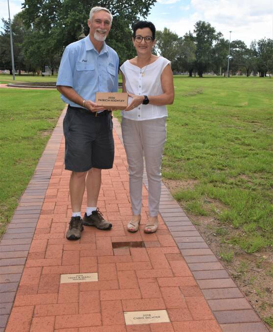 Humble recipient: Mayor Paul Harmon and 2020 Citizen of the Year Trish Keightley ready to lay the paver in Victoria Park on Wednesday.