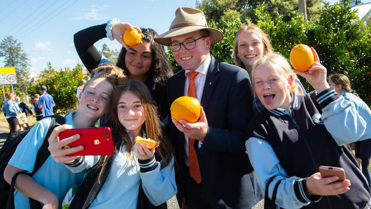 Northern Tablelands MP Adam Marshall tackles time for a selfie with Bingara Central School students at the recent orange picking ceremony.