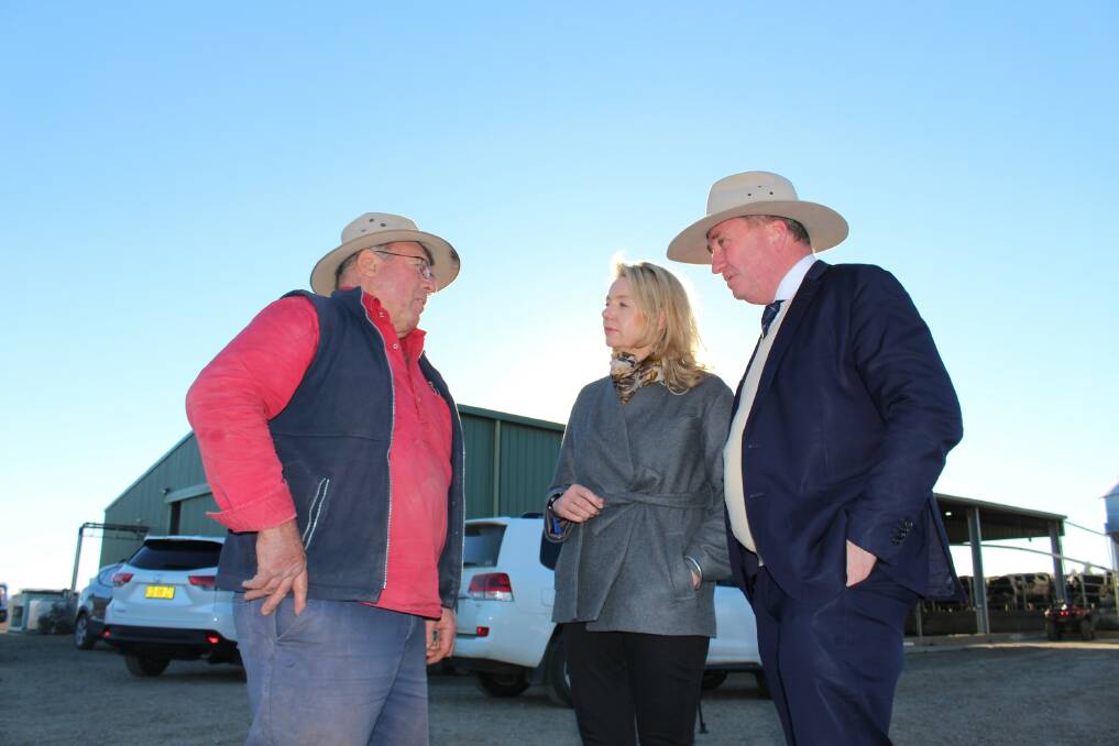 Remote area: Member for New England Barnaby Joyce and Minister for Agriculture Senator Bridget McKenzie (right) discuss ongoing drought conditions with a local farmer.