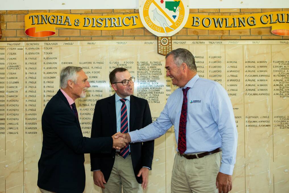Inverell Shire Mayor Paul Harmon, Northern Tablelands Member for Parliament Adam Marshall and Armidale Regional Council Mayor Simon Murray shake hands in Tingha on Friday morning following the announcement.