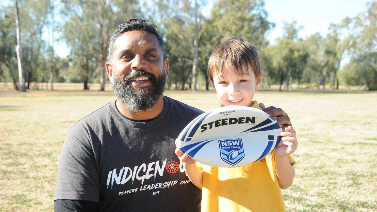 Favourite son: Preston Campbell, pictured here with young fan Ash Jarrett, during a visit to the border regions in 2019, has returned to the Gold Coast Titans in a in performance and administration capacity.