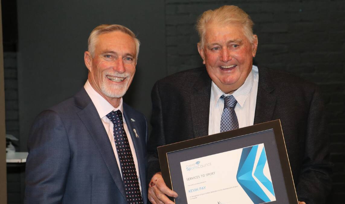 Kevin Pay receives his service to sport award at the Inverell Sports Council 50th anniversary dinner in 2018.