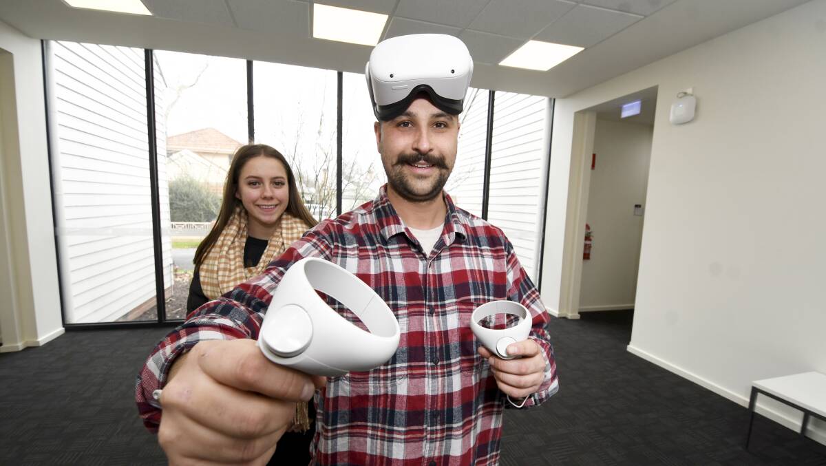 TEACHING TECHNOLOGY: ACU education students Billie Barton and James Mowatt experience the virtual reality they could one day use in the classroom. Picture: Lachlan Bence