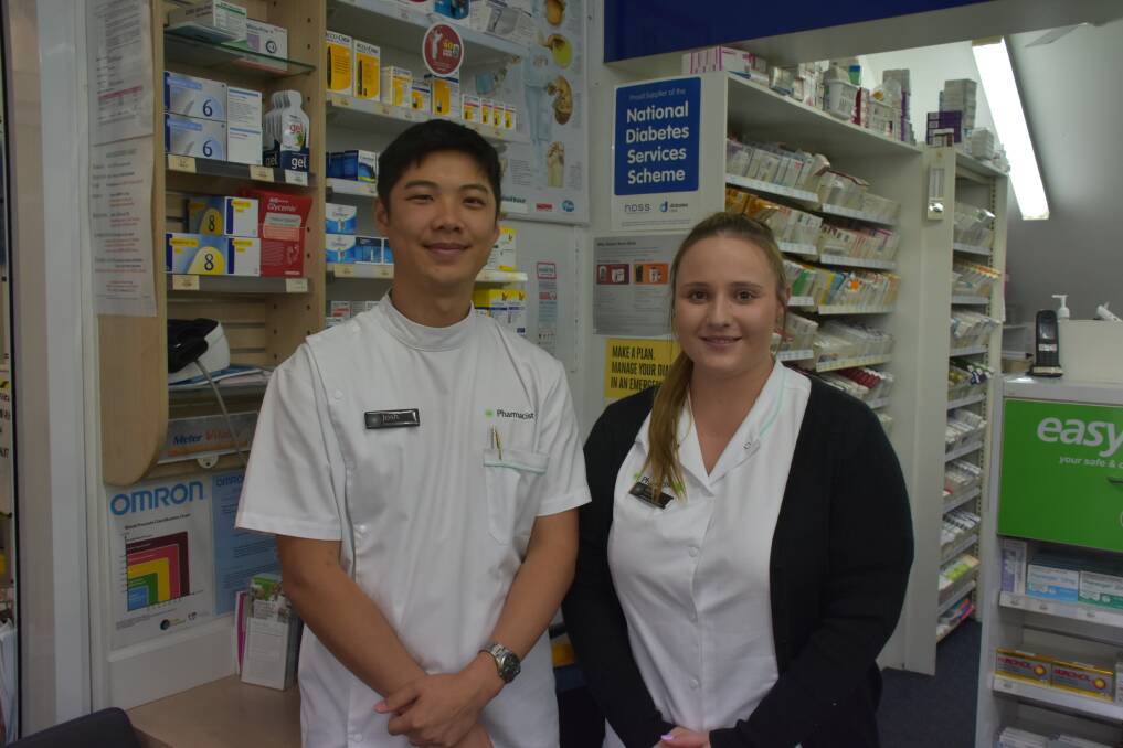 KEEPING WELL: Pharmacists Josh Lee and Amiee Hetherington at Armidale Life Pharmacy. Photo: Nicholas Fuller