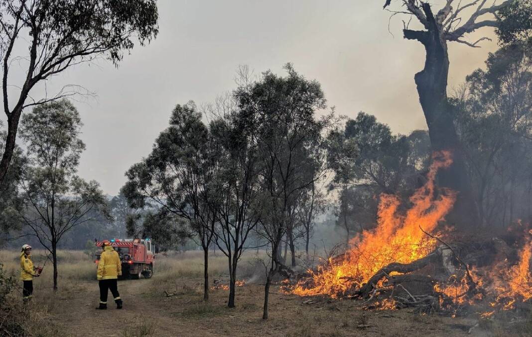FIGHTING BACK: Firefighters were able to increase backburning efforts on Sunday as the conditions improved in Tingha. Photo: NSW RFS