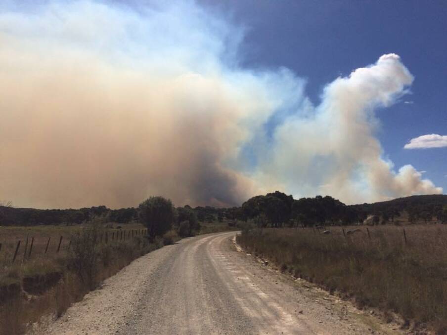 CONTAINED: Smokes billows out of bush-land south of Tingha where volunteer firefighters battled to contain a 1200ha blaze which burned throughout the Easter long weekend. Photo: NSW Rural Fire Service